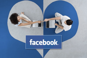 Two couple bonding over a Facebook heart