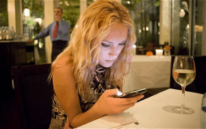 A women reading troubleing stalker messages
